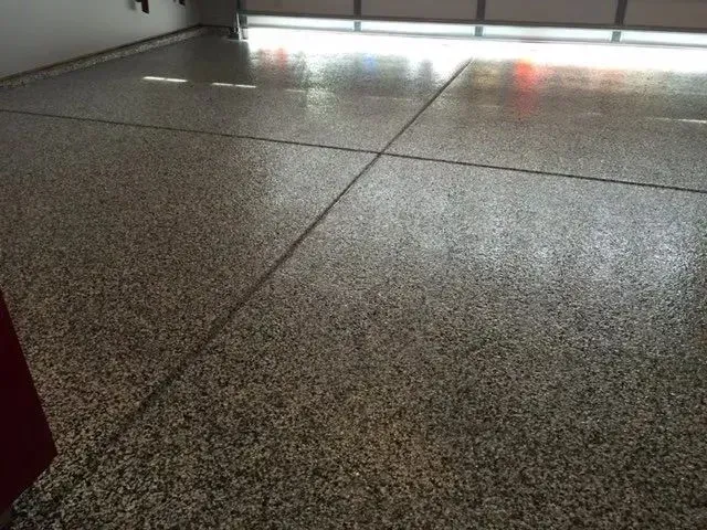 Finished speckled epoxy garage floor.