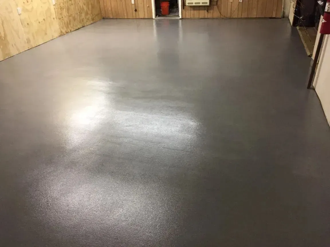 Gray painted concrete floor in a basement.