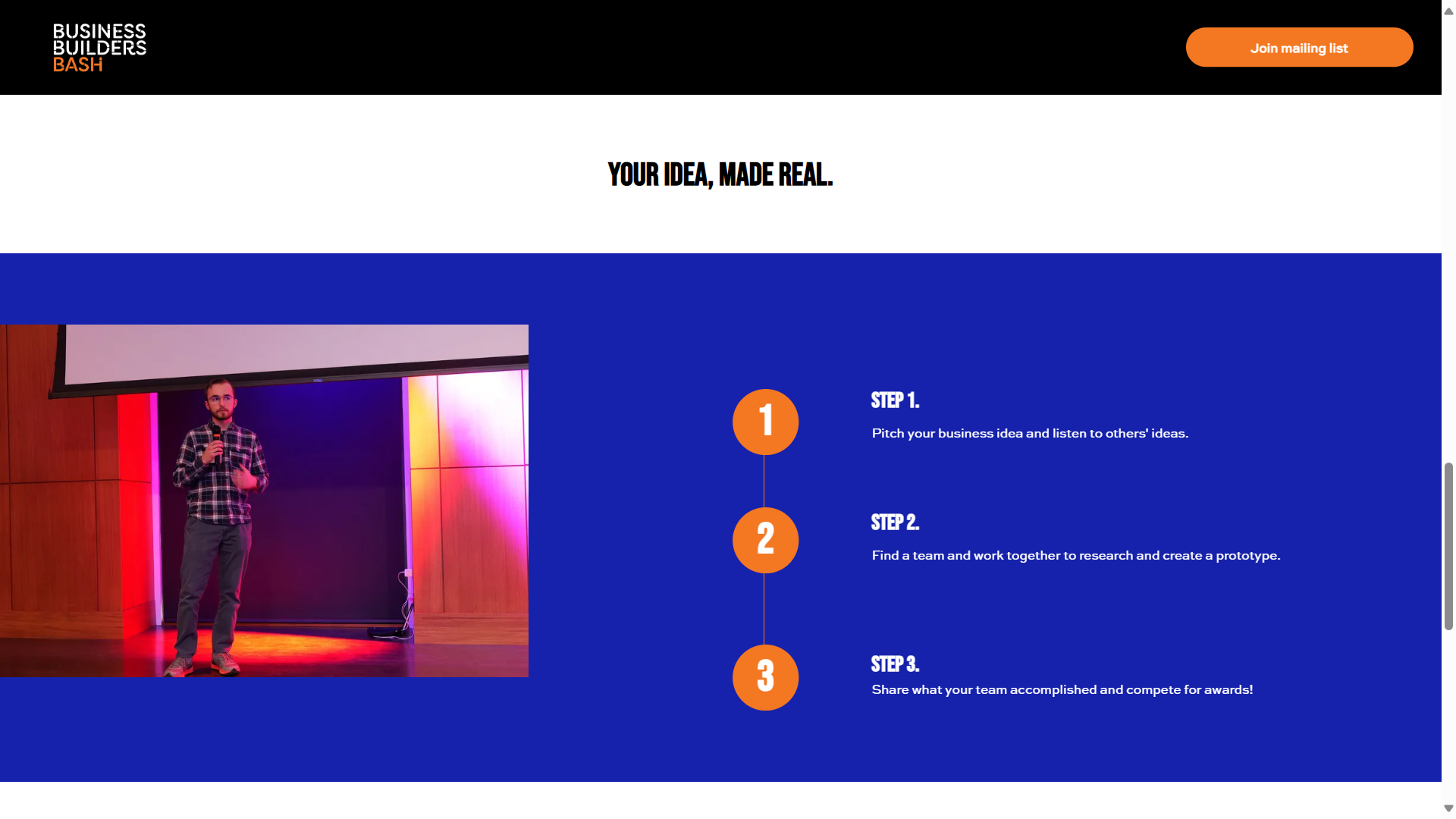 A man is standing on a stage giving a presentation.