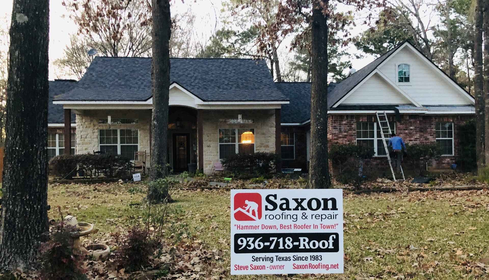 A house with a saxon sign in front of it