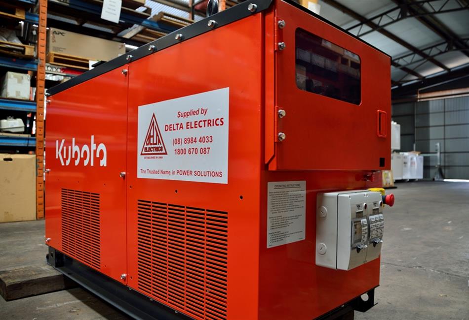 a red kubota machine is sitting in a warehouse