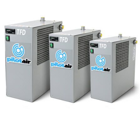 three pilot air air dryers are sitting next to each other on a white surface .