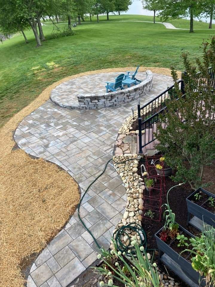 There is a fire pit in the middle of the patio.