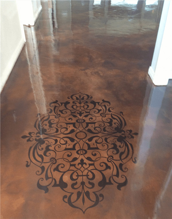Brown metallic floor with a black ornate design in the center.