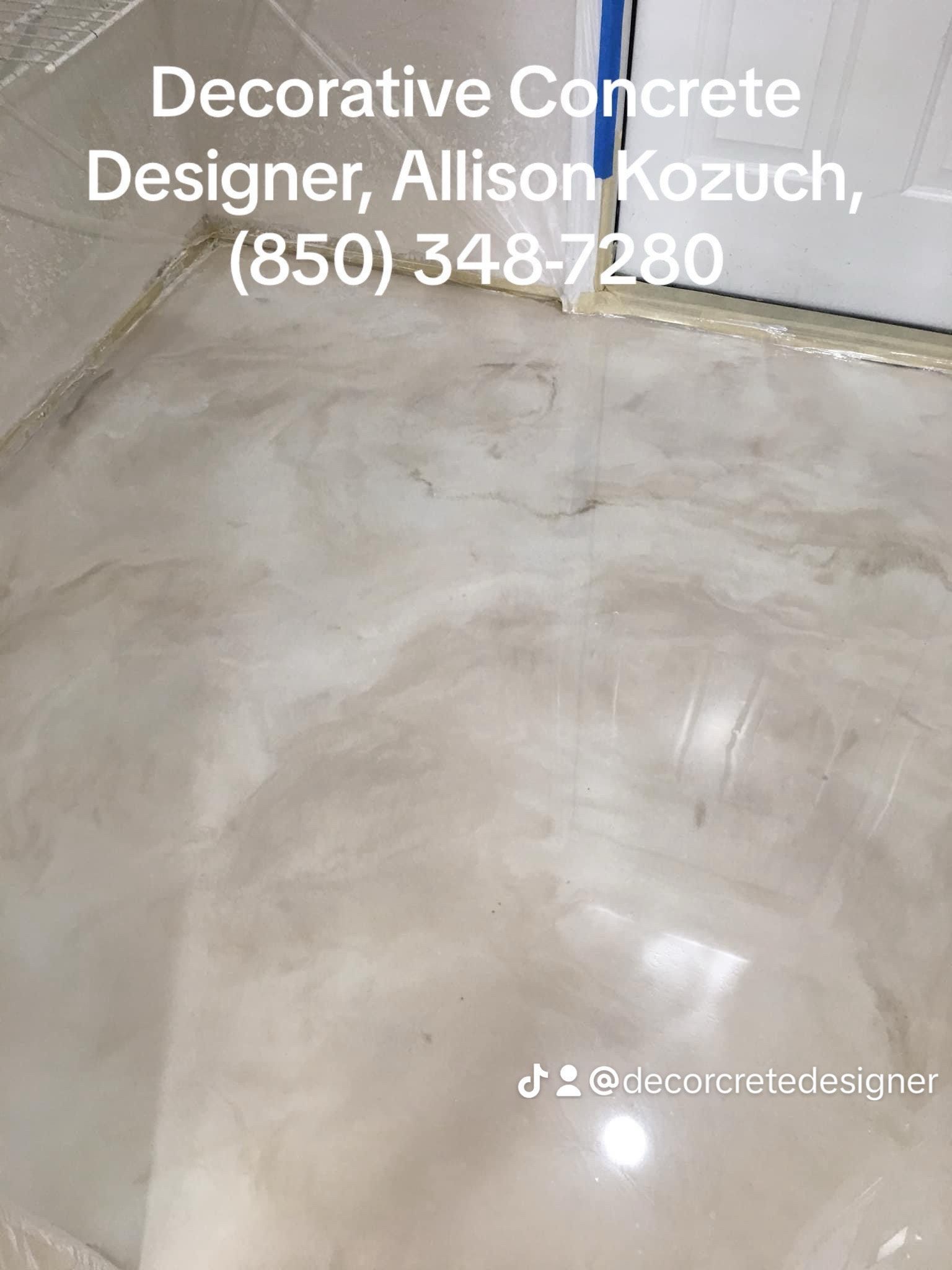 Decorative concrete floor with a marble effect. Text reads Decorative Concrete Designer, Allison Kozuch, (850) 348-7280 and a social media handle.