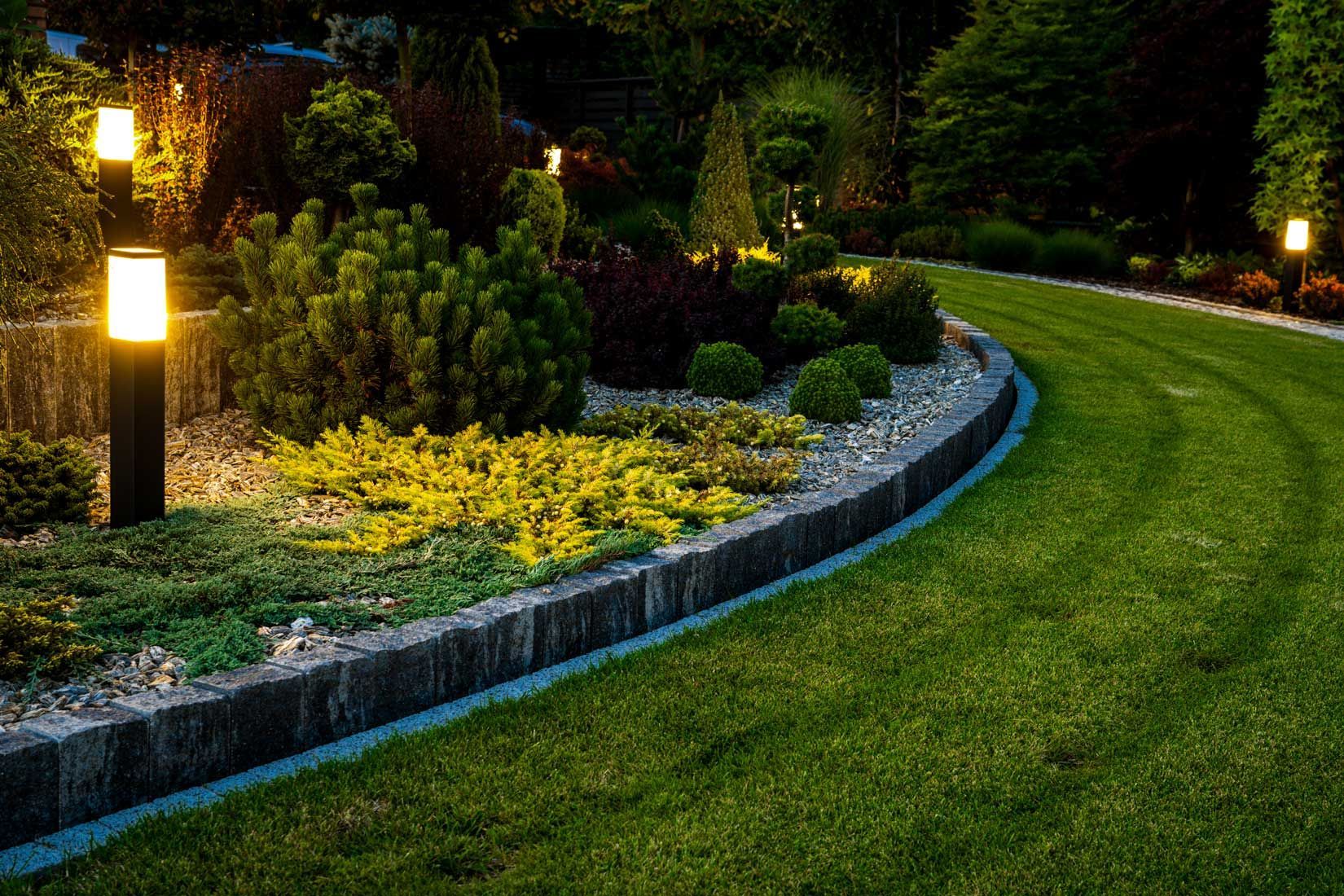 Low-voltage bollard lighting along a landscaped garden path