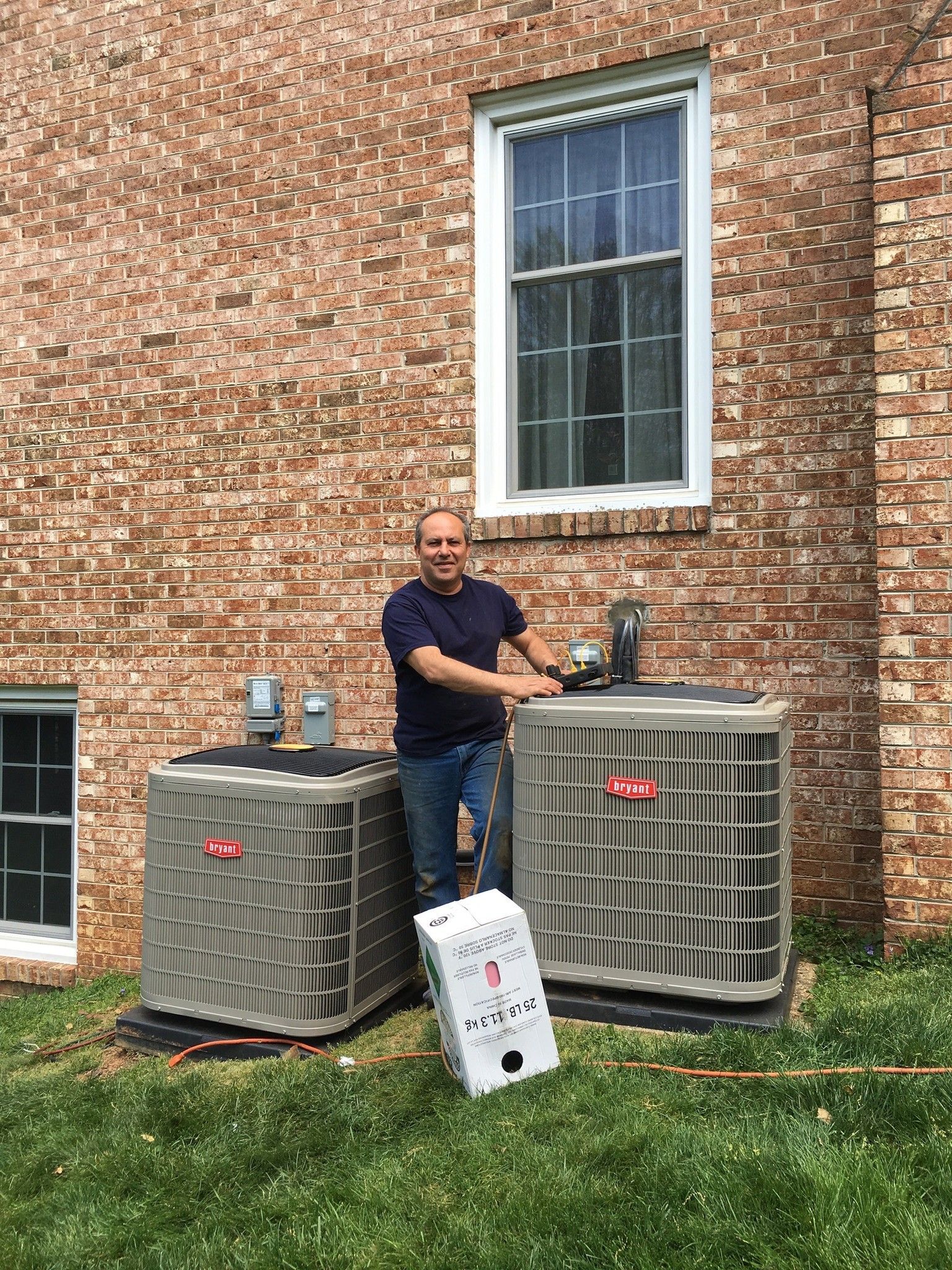 Rockville MD HVAC tech next to an ac unit