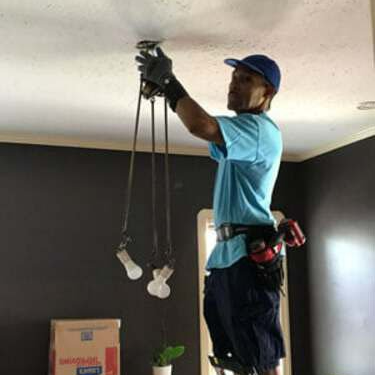 Electrician Fixing Lights — Northfield, OH — Groppi Electric