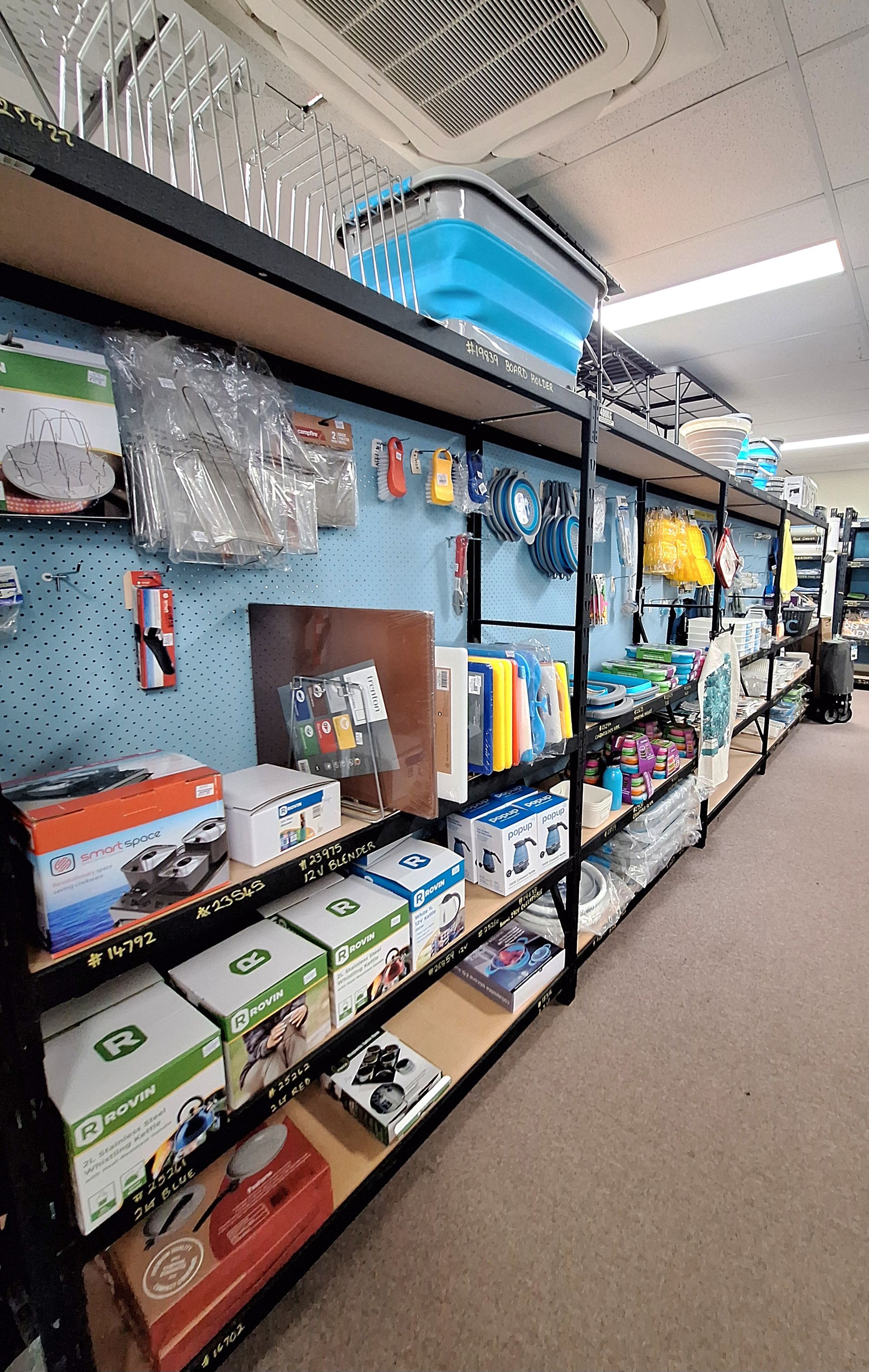 A row of shelves filled with lots of items in a store — BTC Parts & Accessories In Pinelands, NT