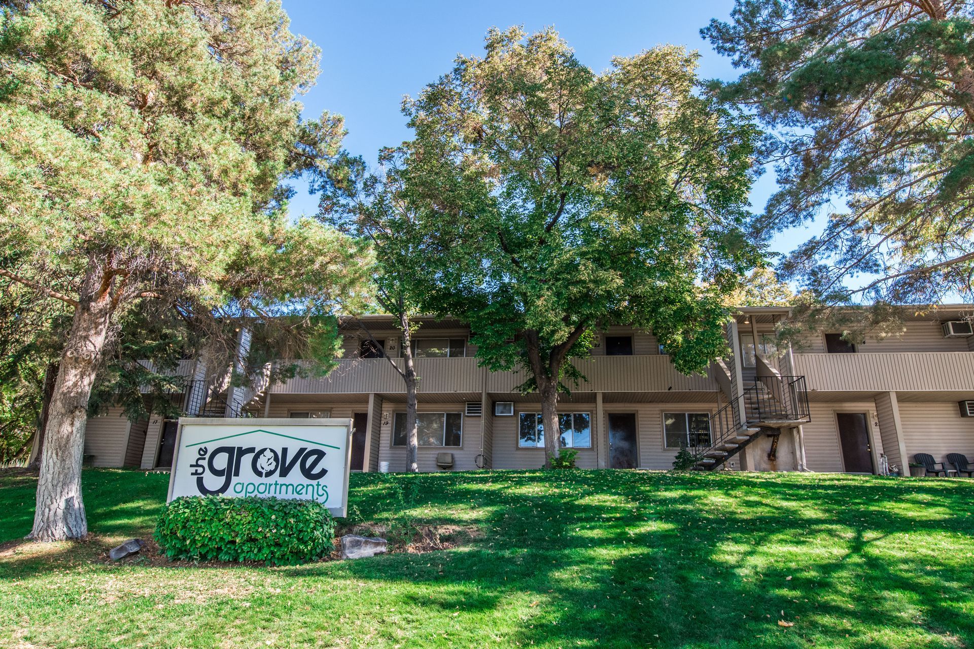 Apartment building with a sign that reads