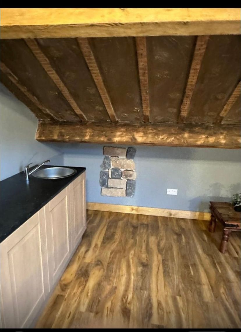 There is a sink in the middle of the room.