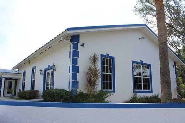 A white house with blue trim and windows