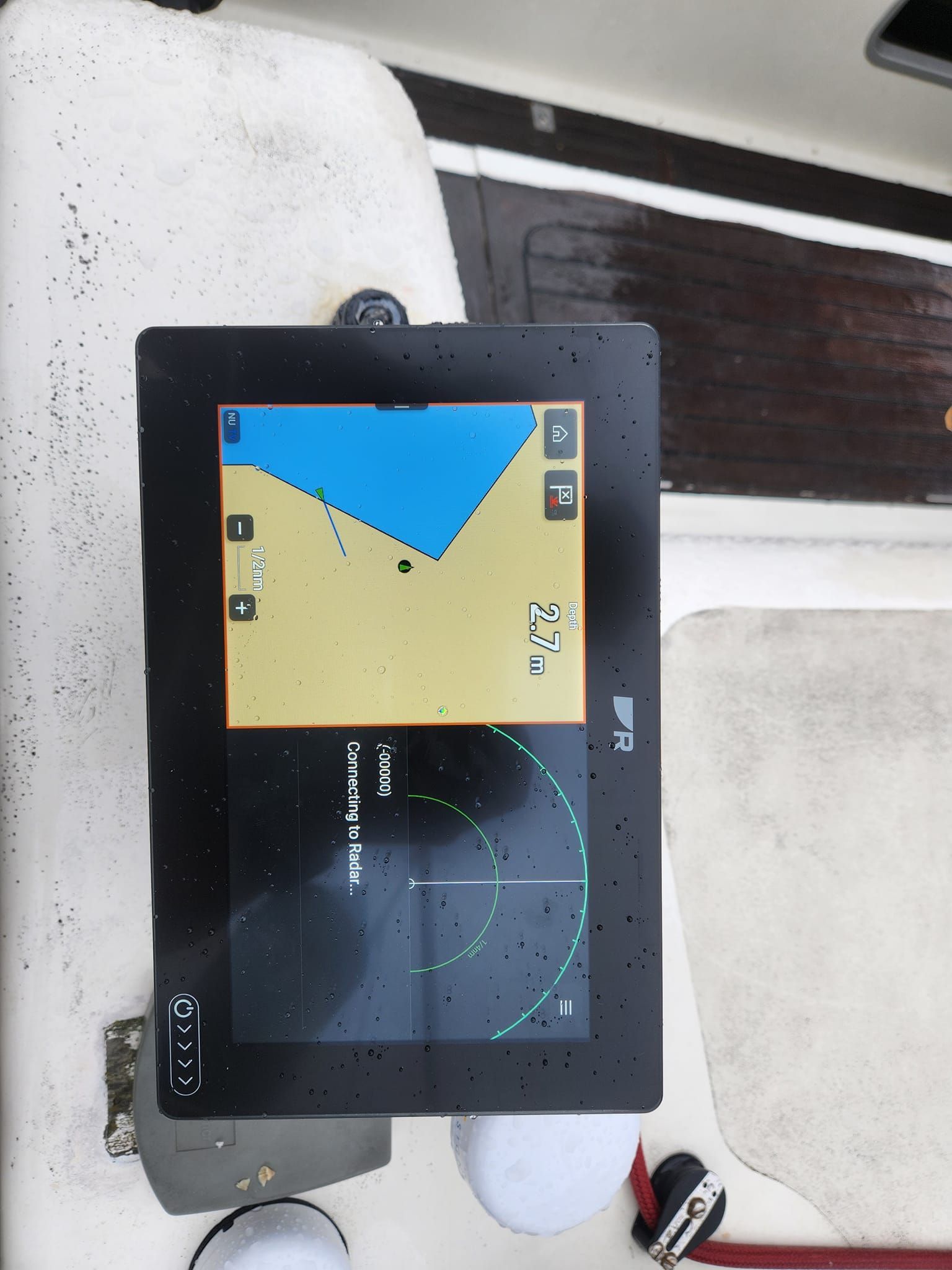 A gps device on a boat shows a map of the ocean