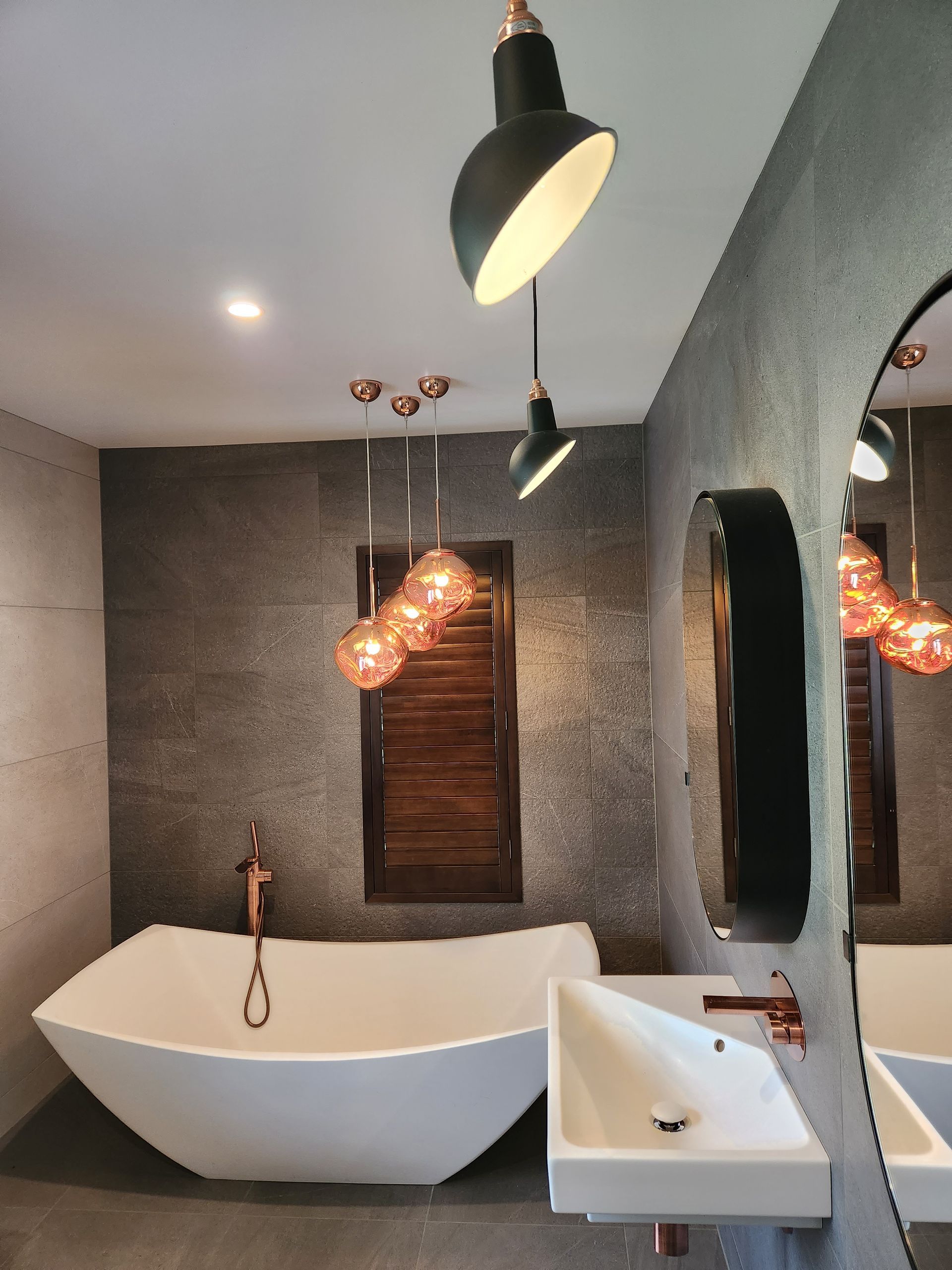 A person is using a multimeter to test an electrical outlet.