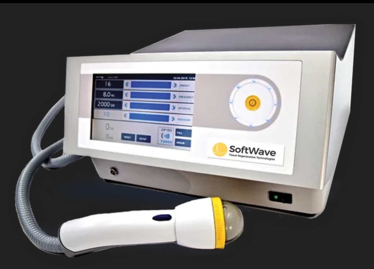 SoftWave medical device with a touchscreen display and handheld applicator.