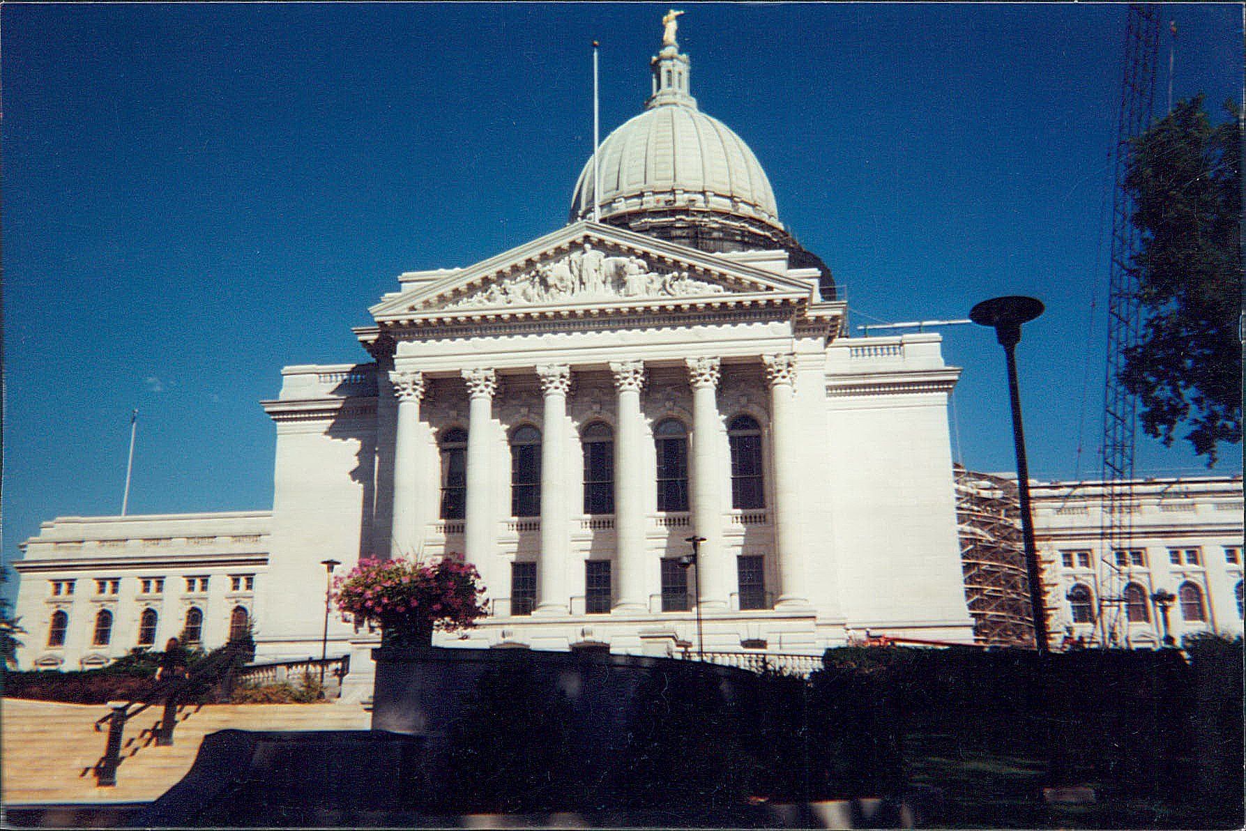 A large white building with a dome on top of it