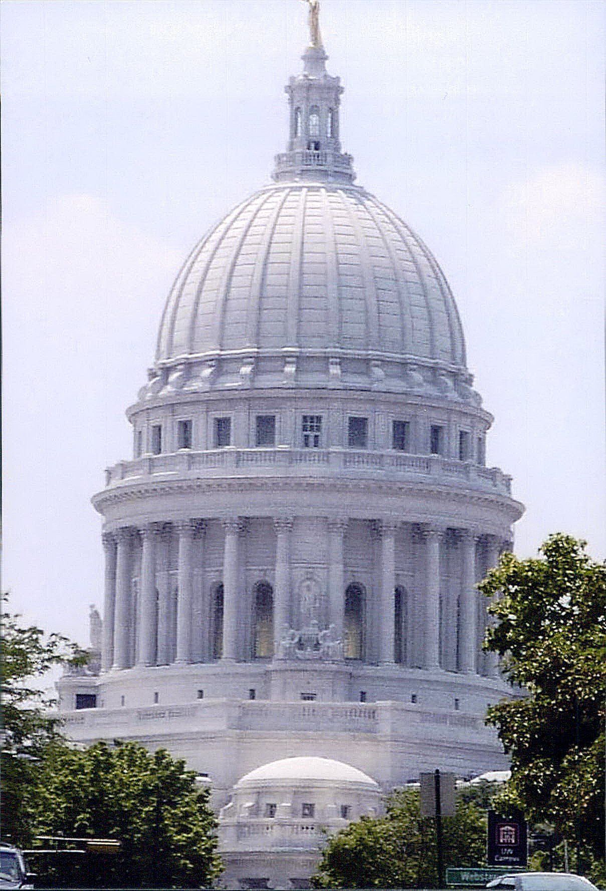 A large white building with a dome on top of it