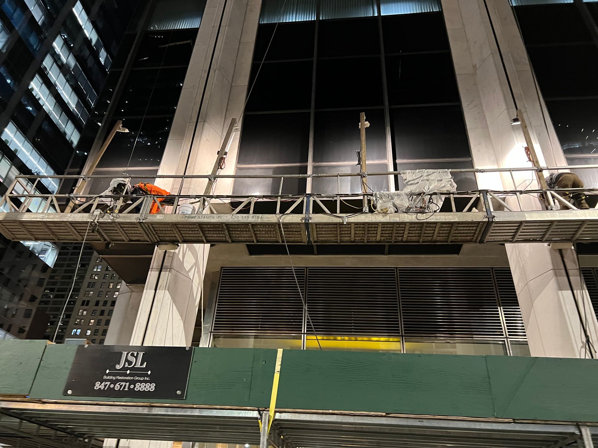 A construction site with a sign that says jsl on it