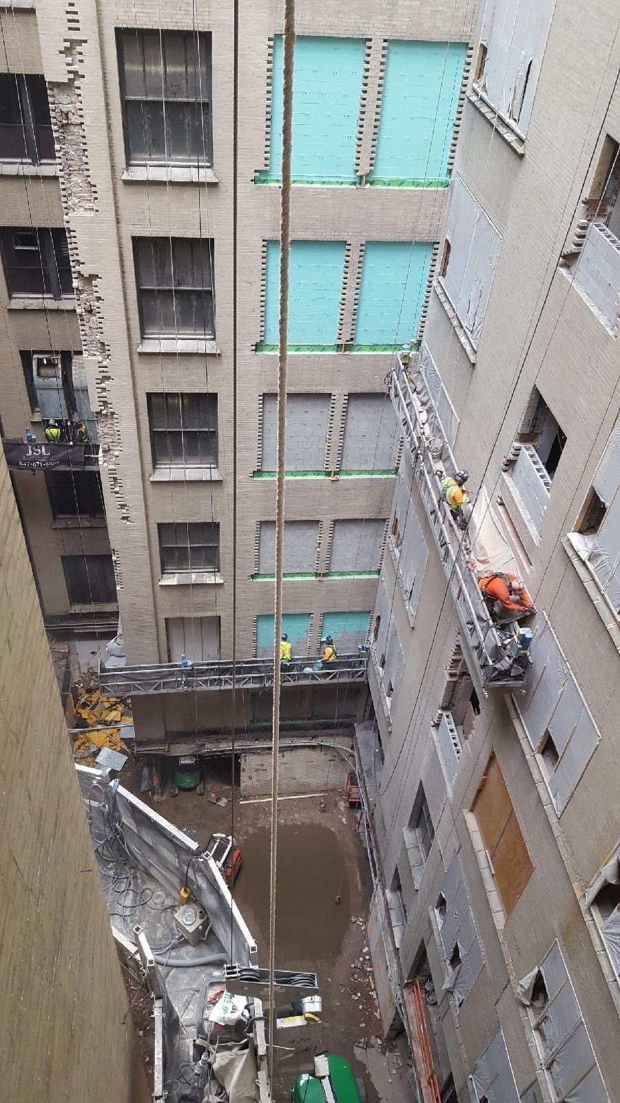 A large building with a lot of windows is being built.