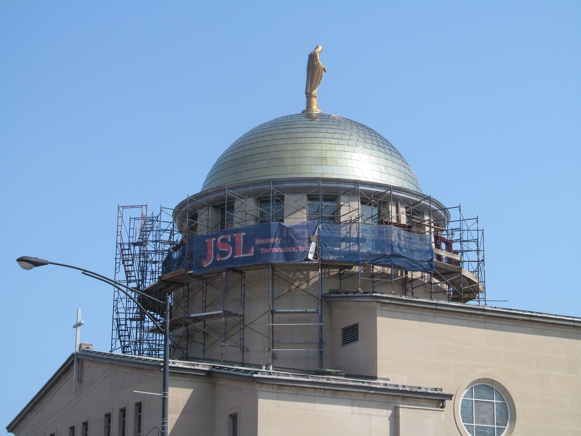 A dome on top of a building that says jsl on it