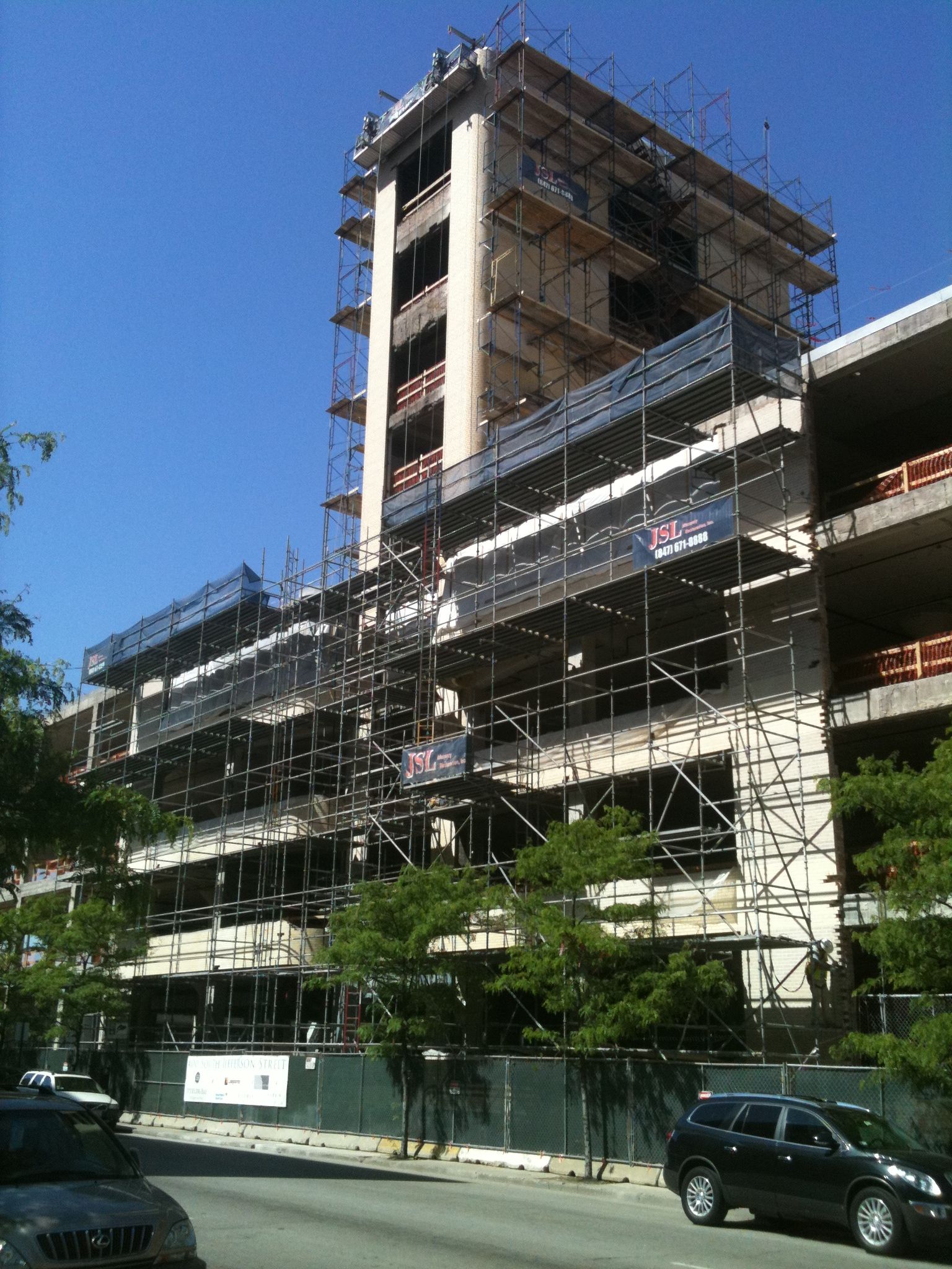 A large building under construction with scaffolding around it