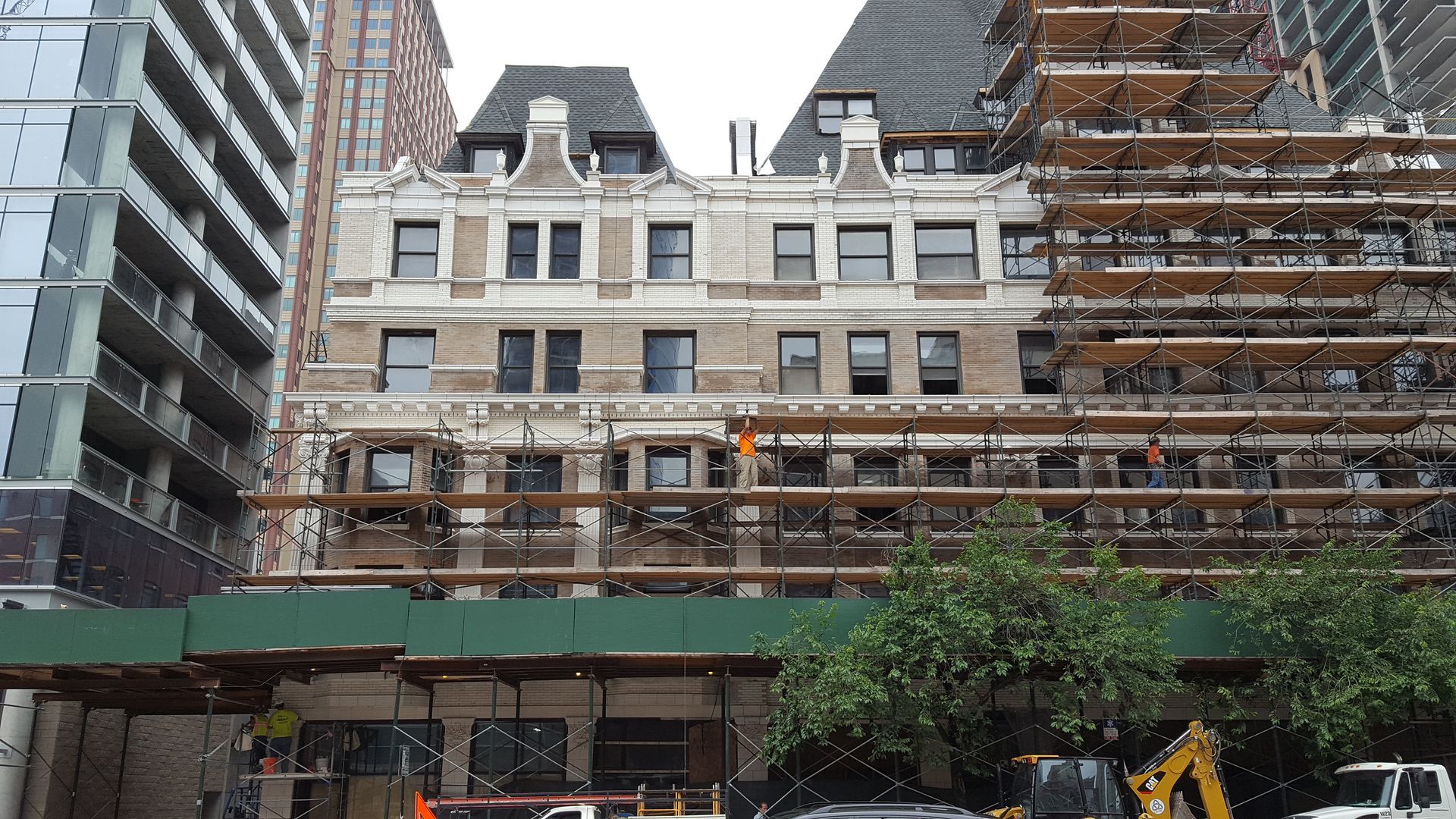 A large building under construction with scaffolding around it