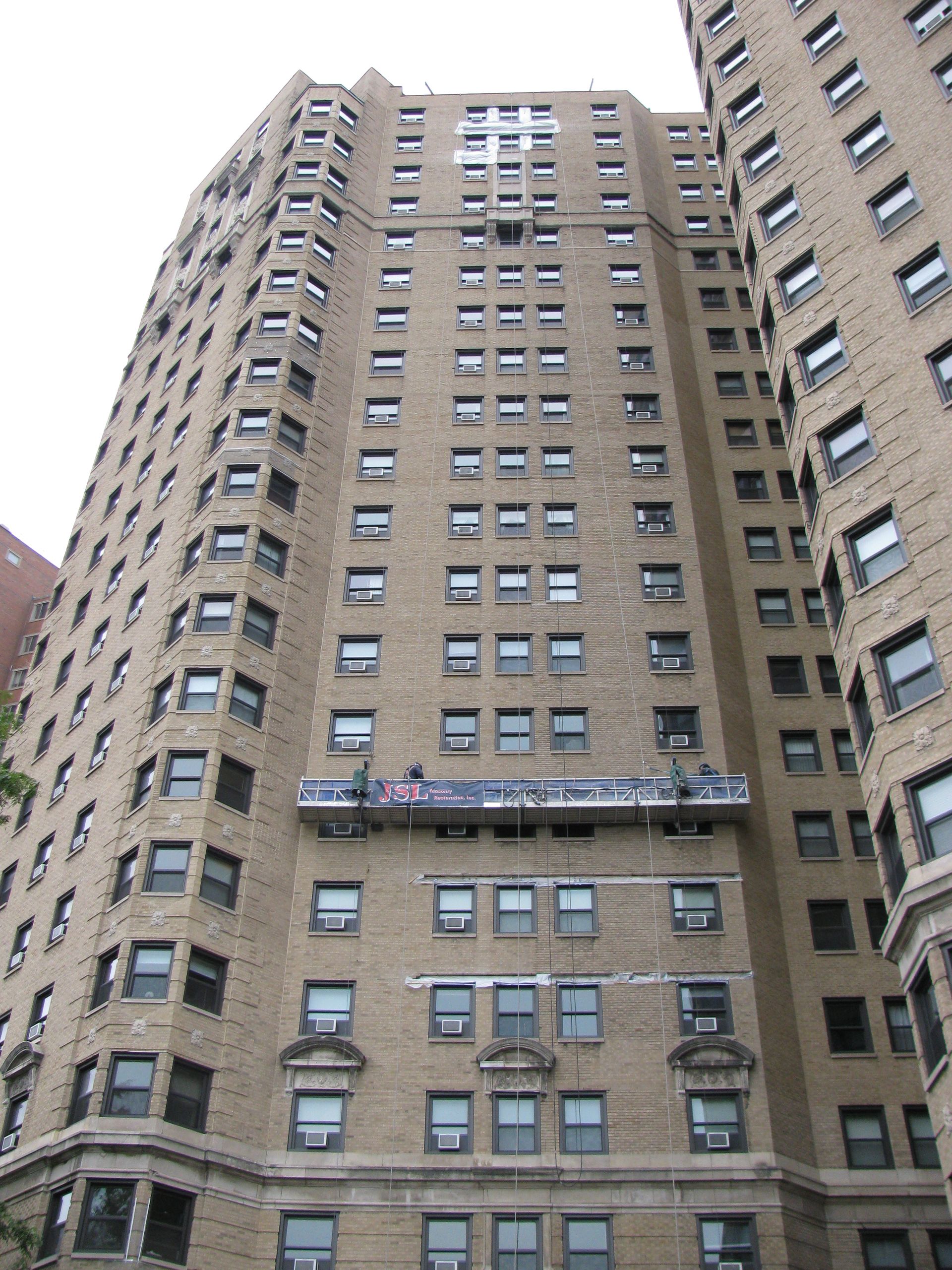 A tall building with a scaffolding on the side of it