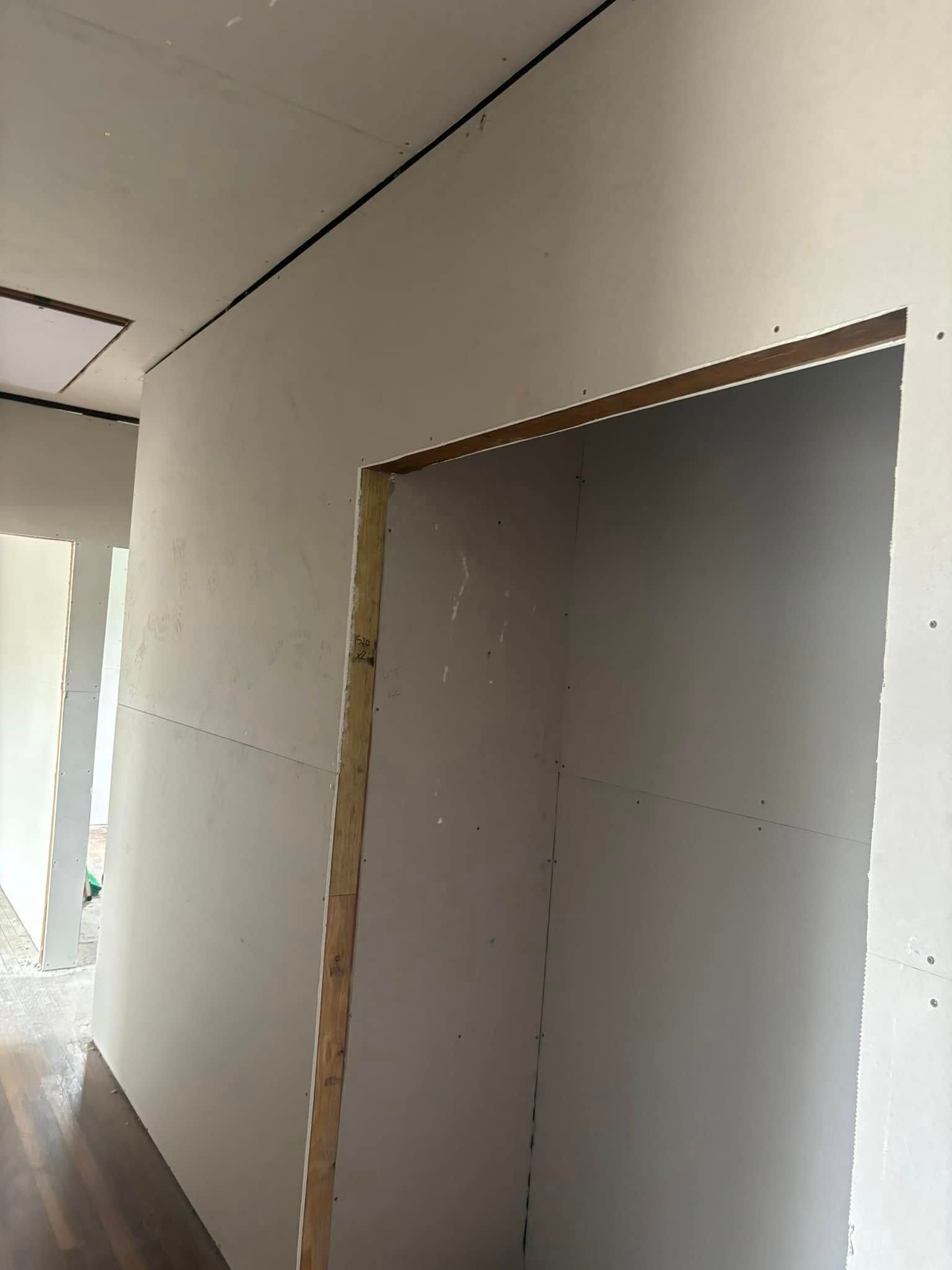 An Interior View Of A Room Under Construction, Featuring Newly Installed Drywall Panels — HJK Plastering In Lennox Head, NSW