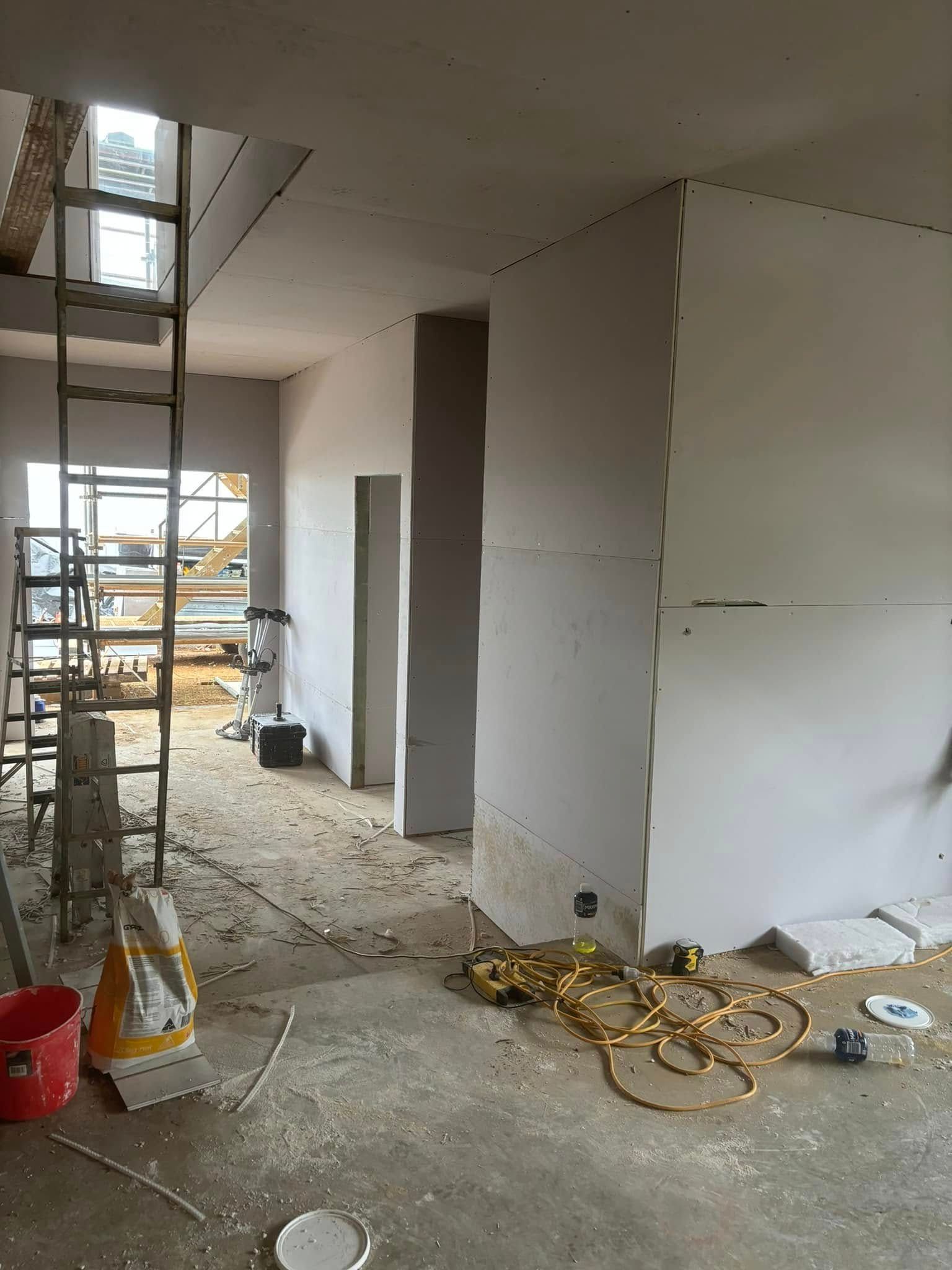 An Interior View Of A Room Under Construction With Drywall Installed — HJK Plastering In Casino, NSW
