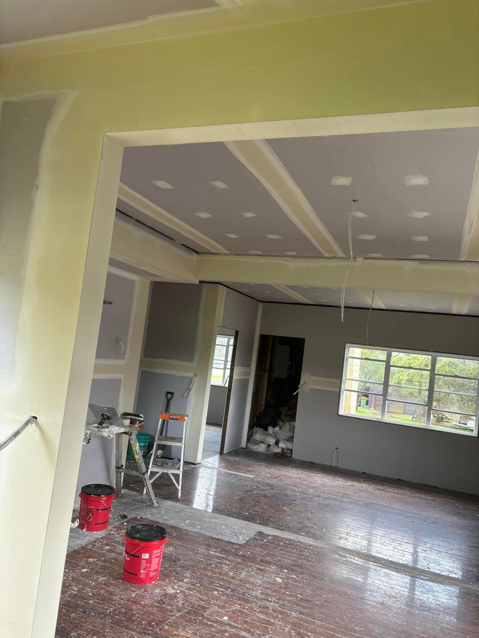 An Interior Room Under Renovation With Light Yellow Walls — HJK Plastering In Lismore, NSW