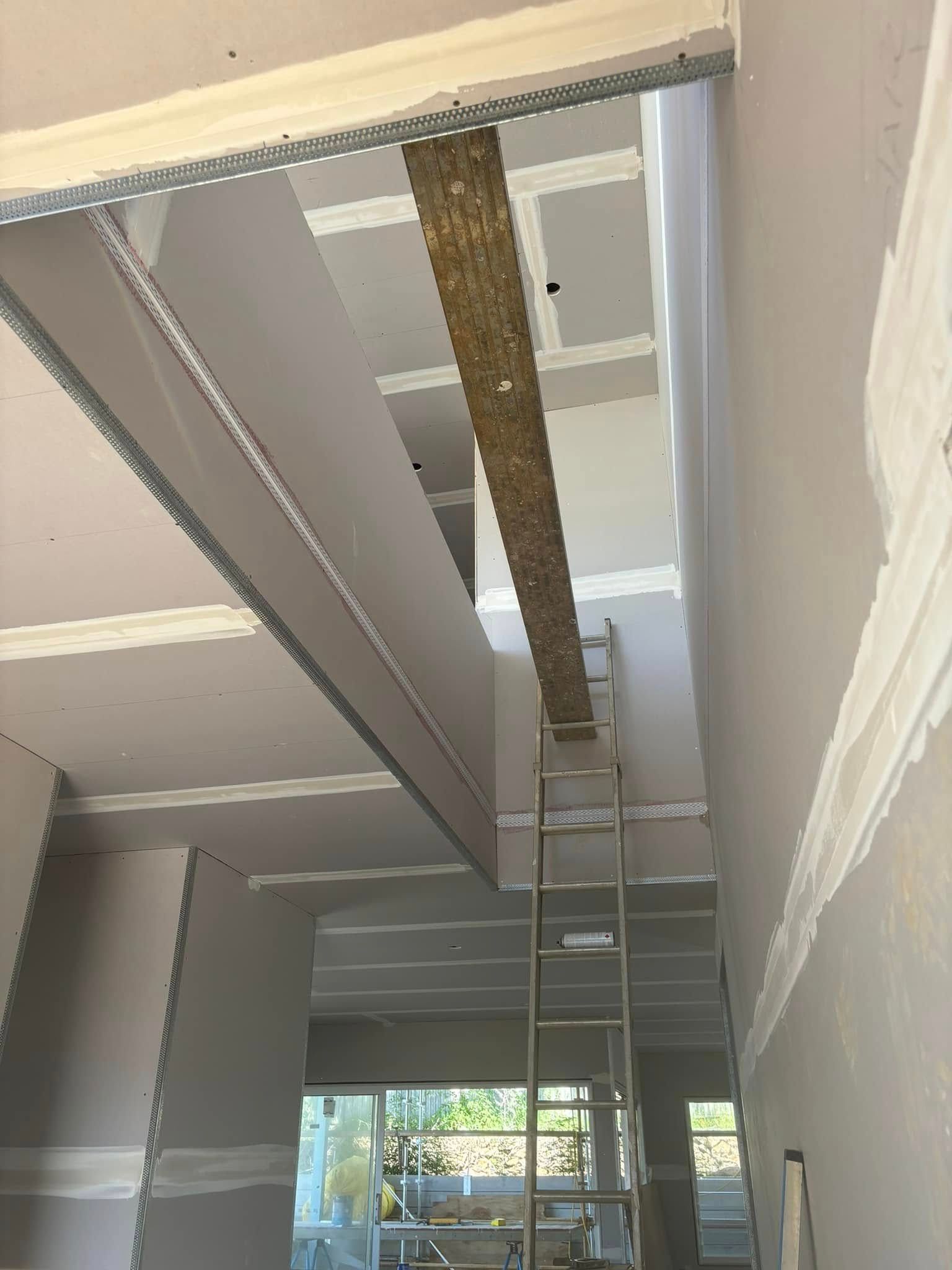 An Interior View Of A Room Under Construction With Exposed Metal Framing — HJK Plastering In Mullumbimby, NSW