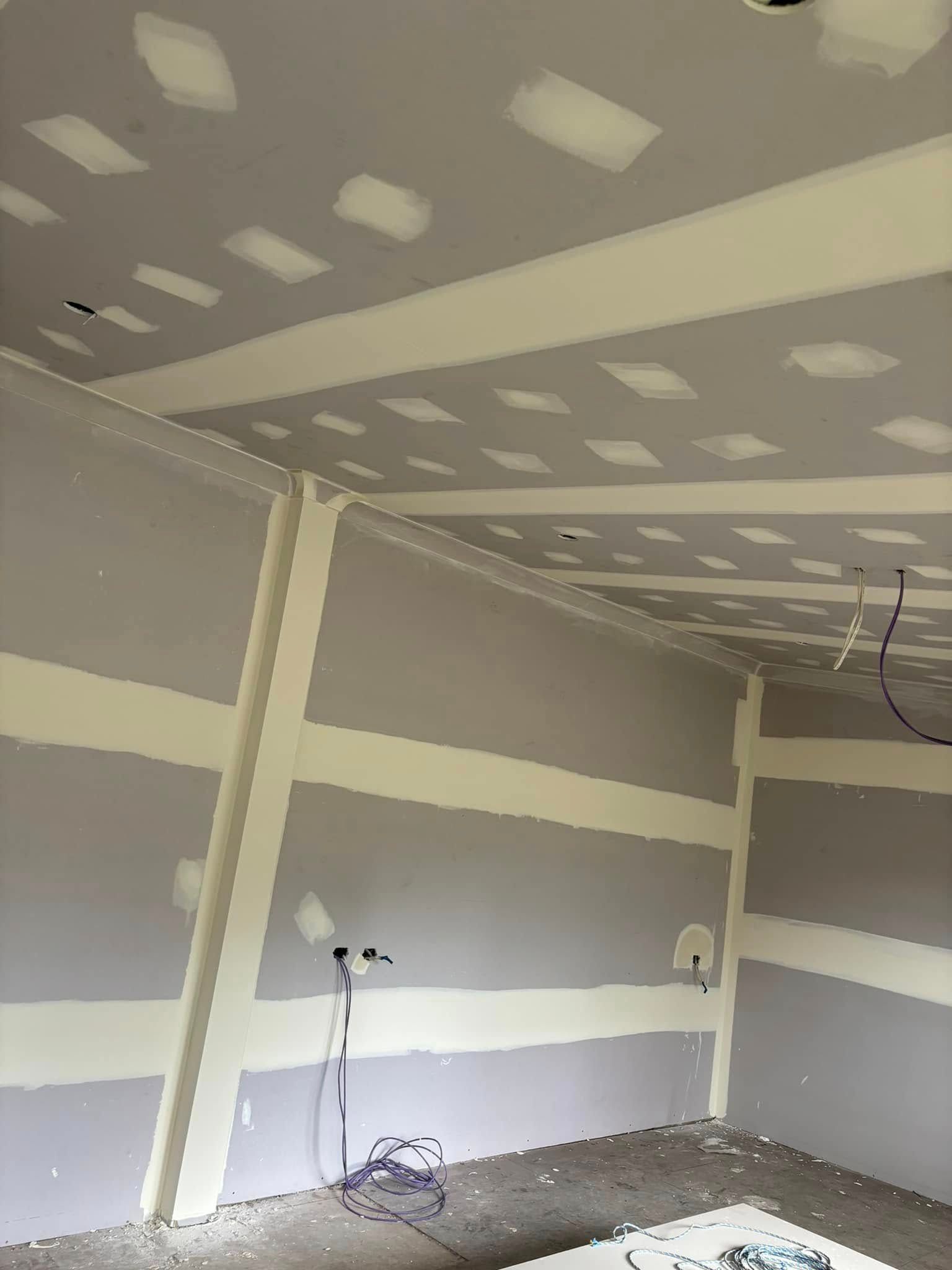 Drywall-covered Walls And Ceiling In A Room Under Construction — HJK Plastering In South Lismore, NSW