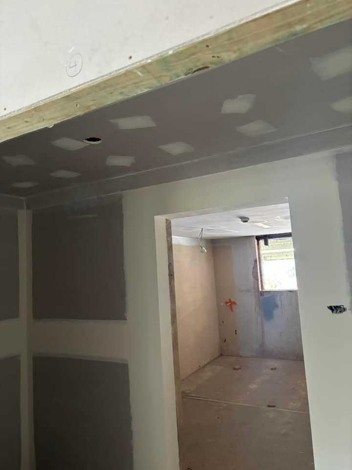 Interior View Of A Construction Site Showing Drywall Panels Installed On Ceilings — HJK Plastering In Lismore, NSW
