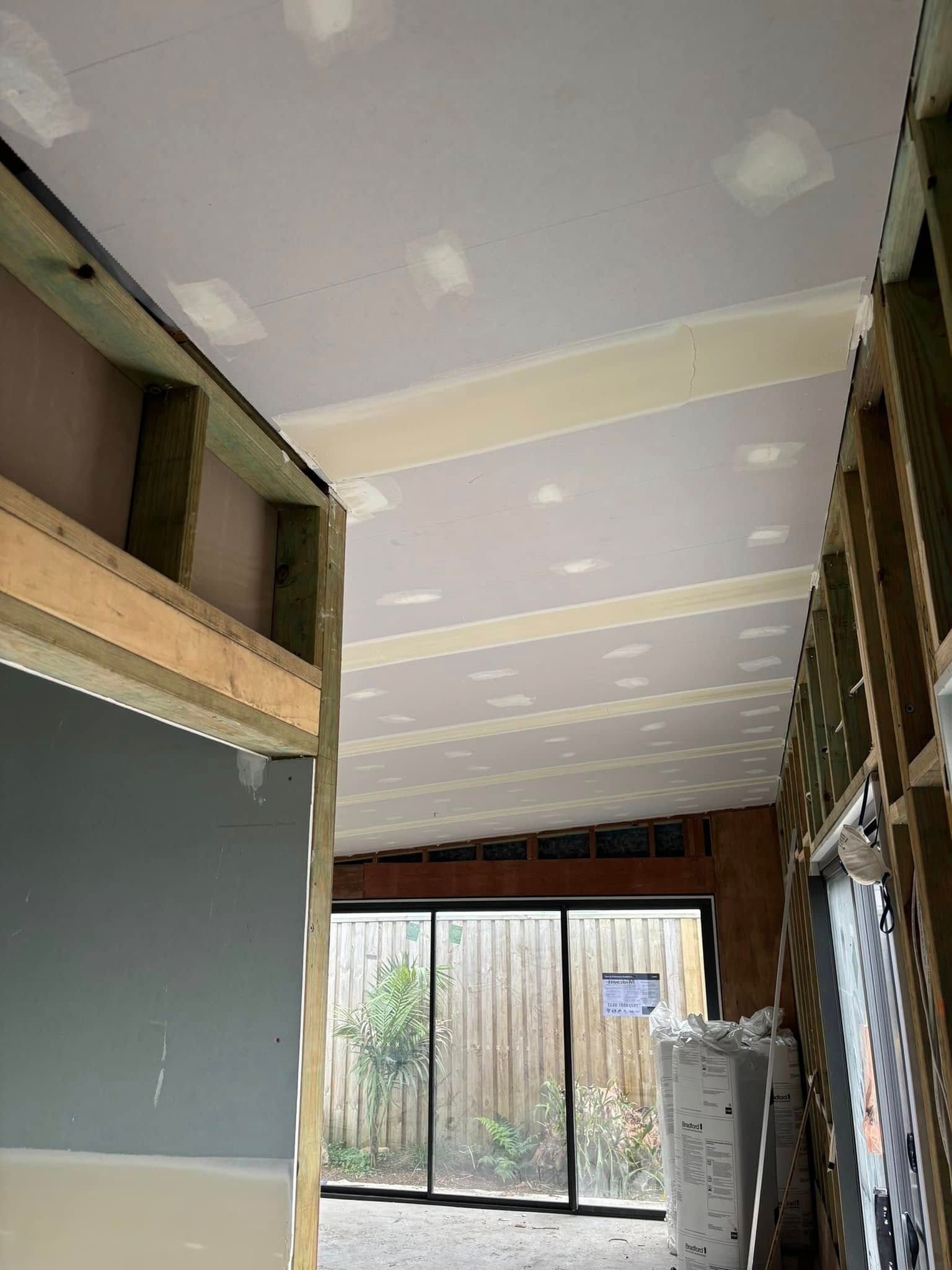 A Partially Finished Indoor Construction Space With Exposed Wall Framing — HJK Plastering In Casino, NSW