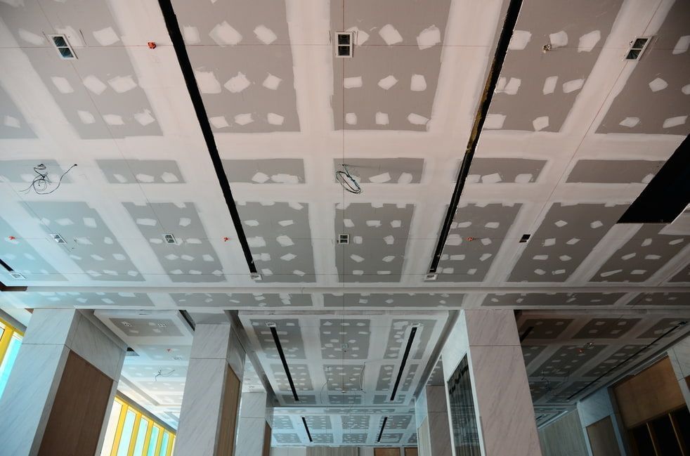 A Low-angle View Of A Large Commercial Ceiling Under Construction — HJK Plastering In Lennox Head, NSW