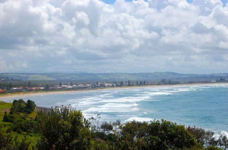 A View of the Ocean From a Hill With Trees in the Foreground — HJK Plastering In Lennox Head, NSW