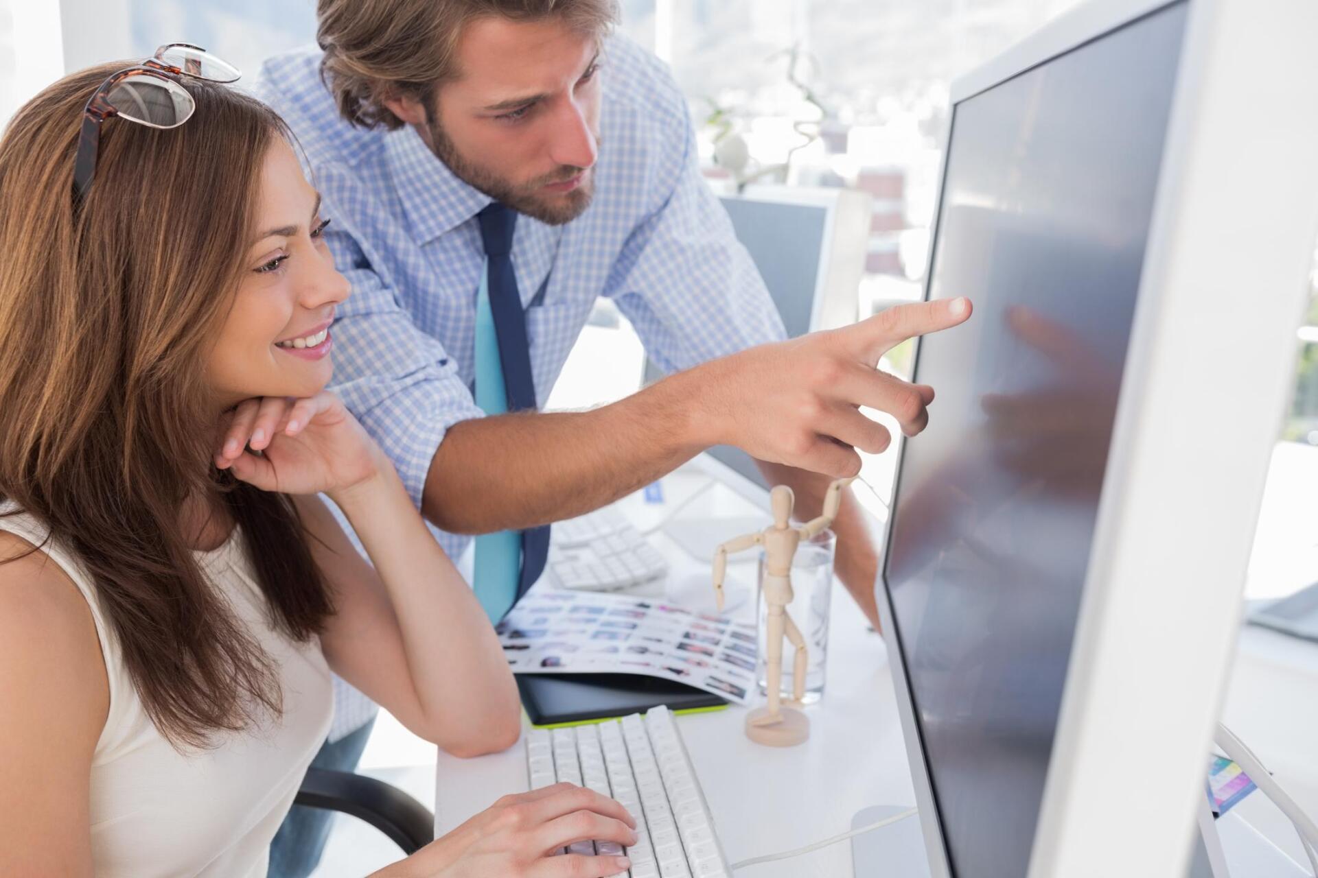 man pointing at the monitor