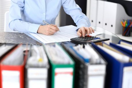 worker writing in the paper