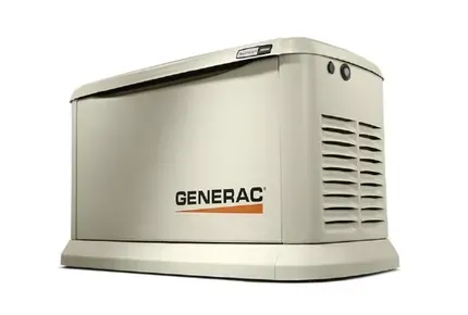 A generator is sitting in the grass in front of a house.