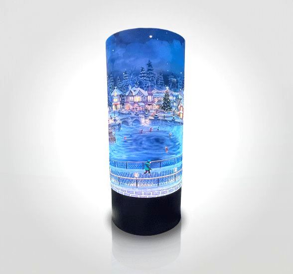 A lamp with a picture of a snowy city on it.