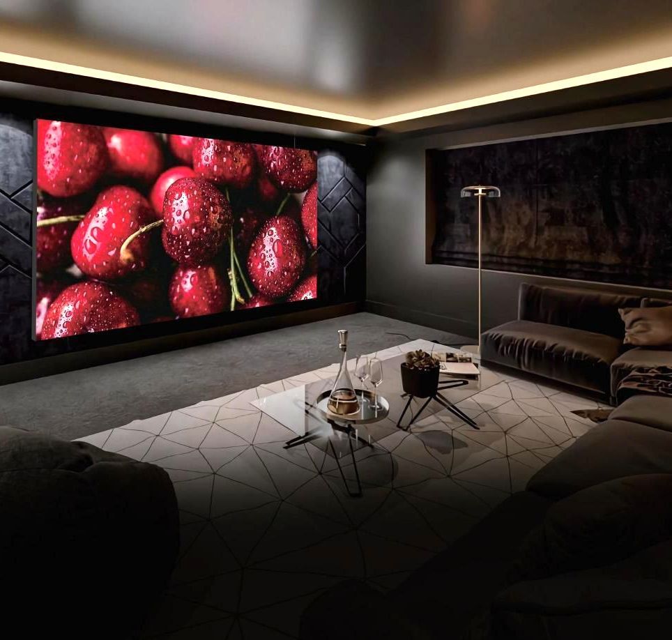 A living room with a large picture of cherries on the wall