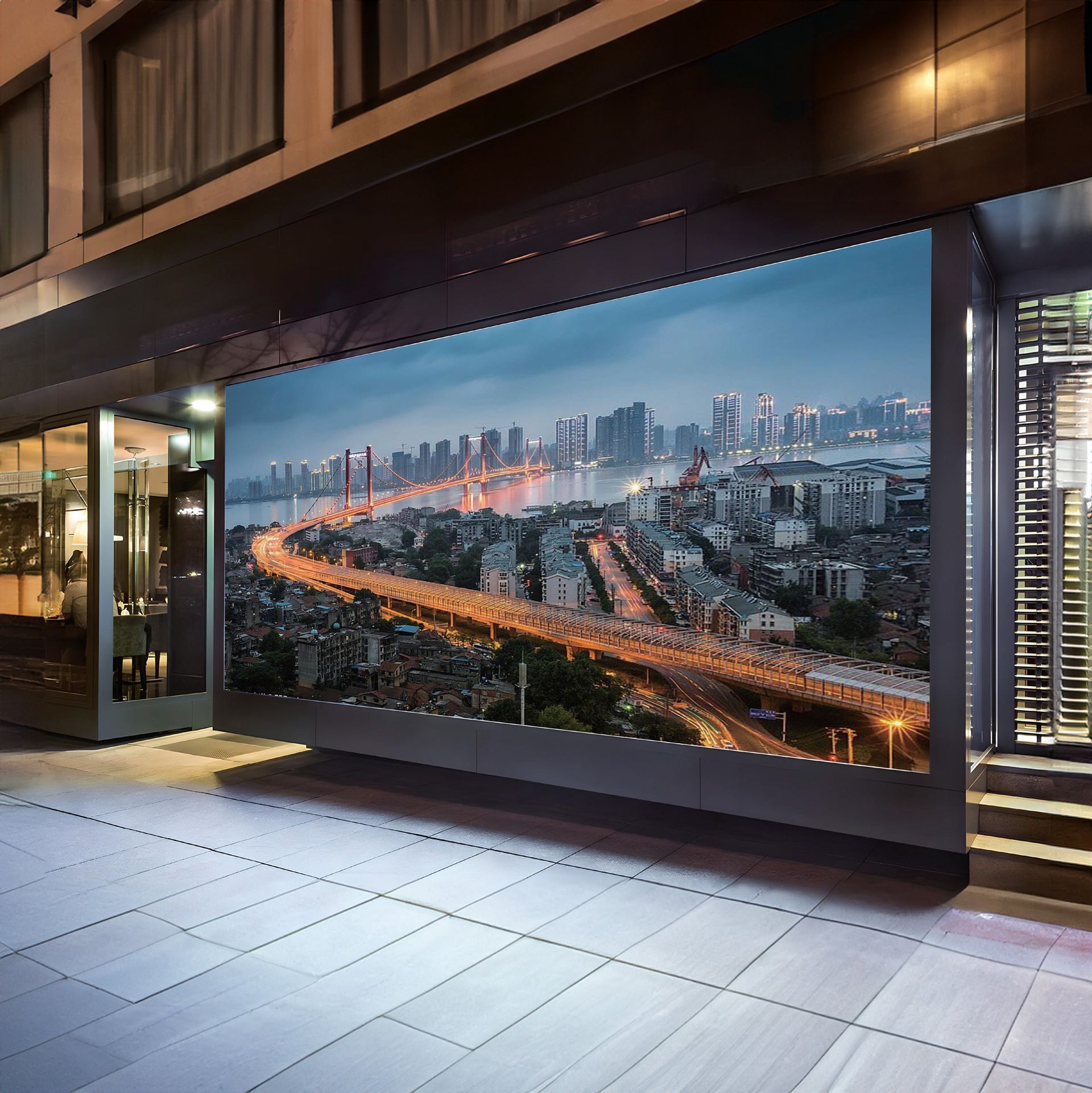 A large picture of a city is on the side of a building