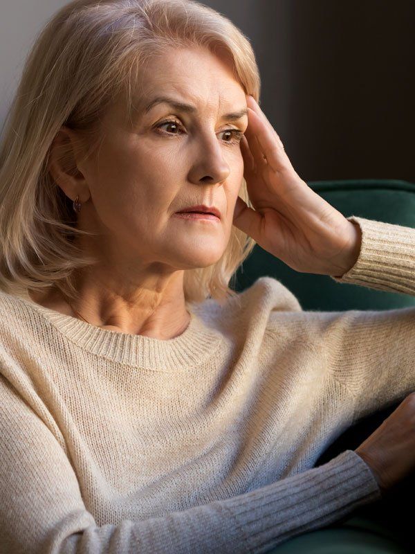 Grieving Lady Wearing Beige Sweater