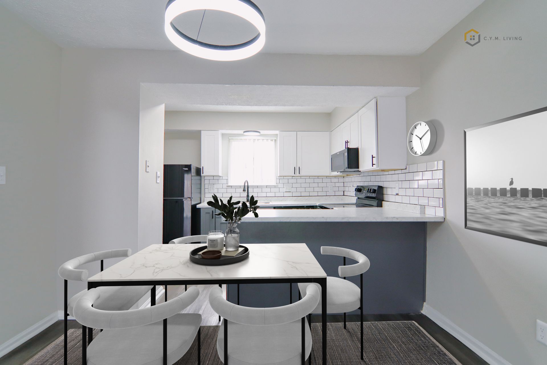 Dining area with marble table, white chairs, and an open kitchen.