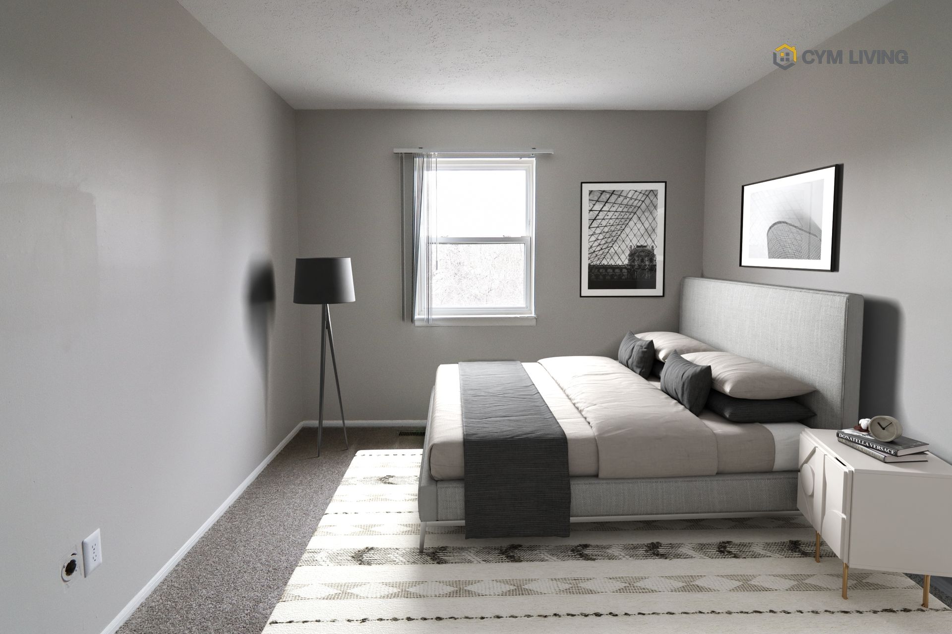 Bedroom with gray walls, bed, artwork, and a floor lamp.