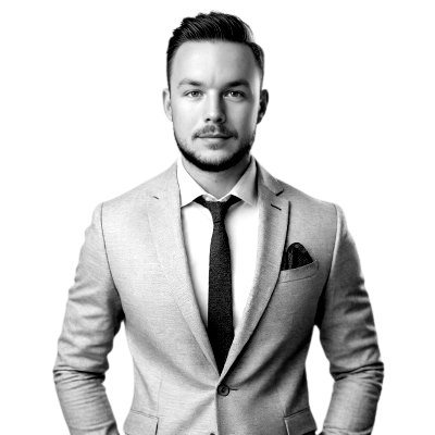 Een man in pak en stropdas met zijn handen in zijn zakken