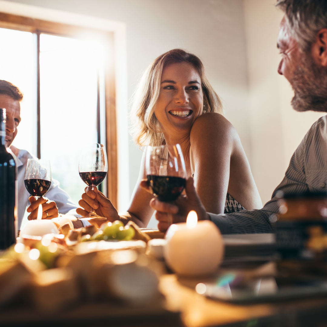 A woman wearing a knitted hat and a fur coat is standing in the snow.