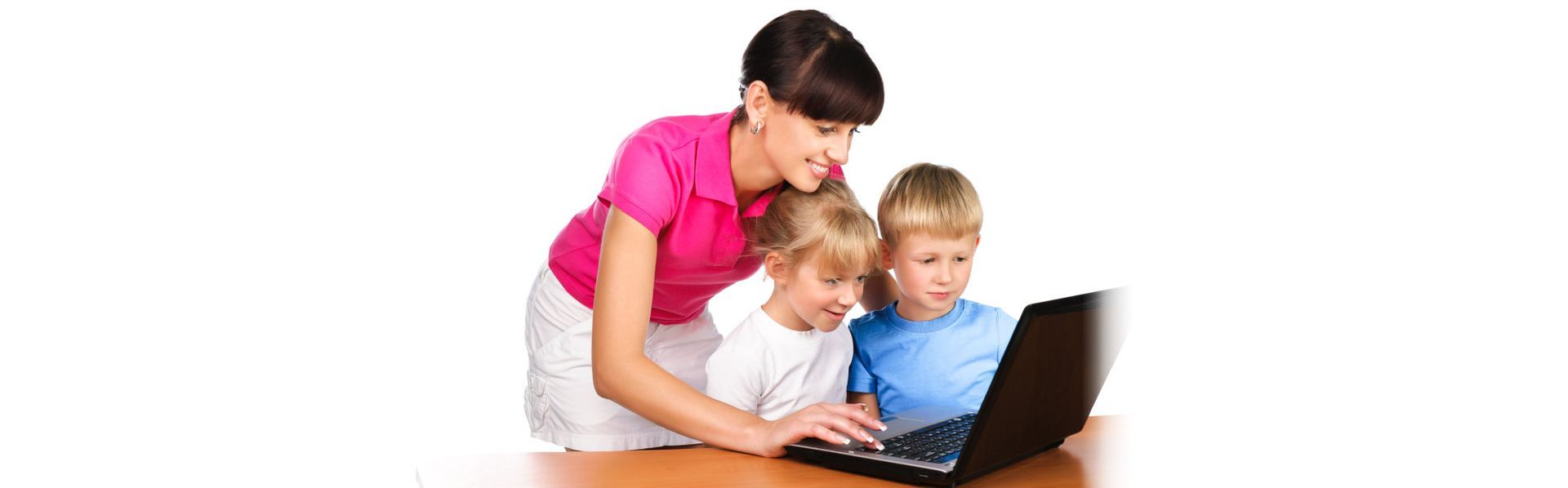 A woman and two children are looking at a laptop computer.