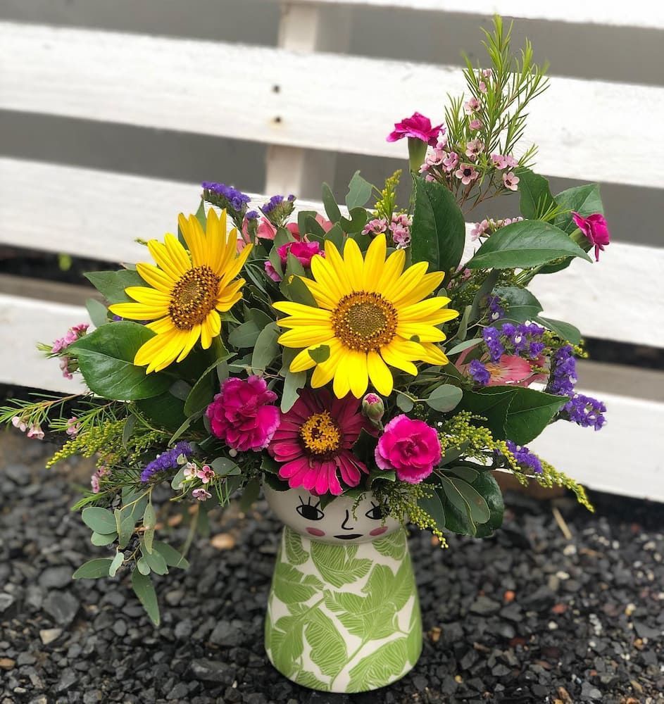 A Green Vase Filled With Sunflowers And Other Flowers — Clover Country Flowers and Gifts In Pittsworth, QLD