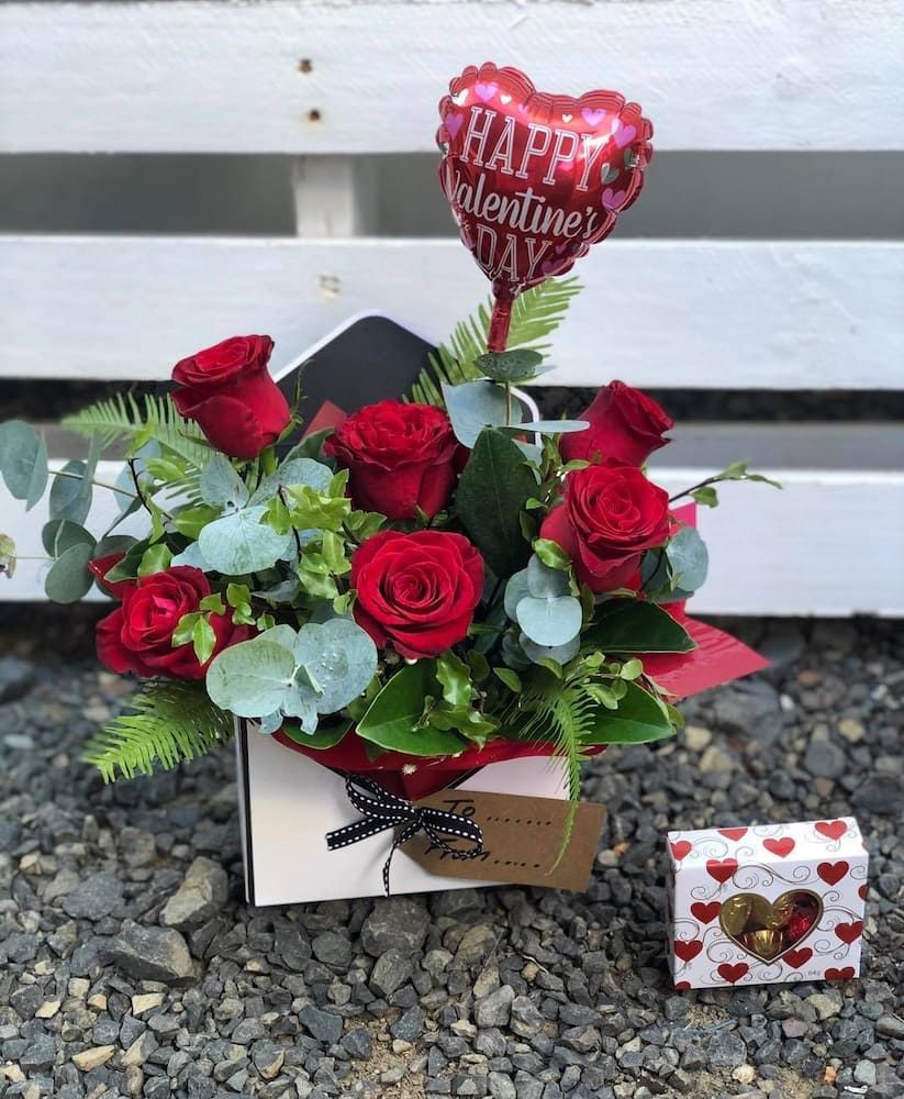 A Box Filled With Red Roses And A Heart Shaped Balloon — Clover Country Flowers and Gifts In Highfields, QLD